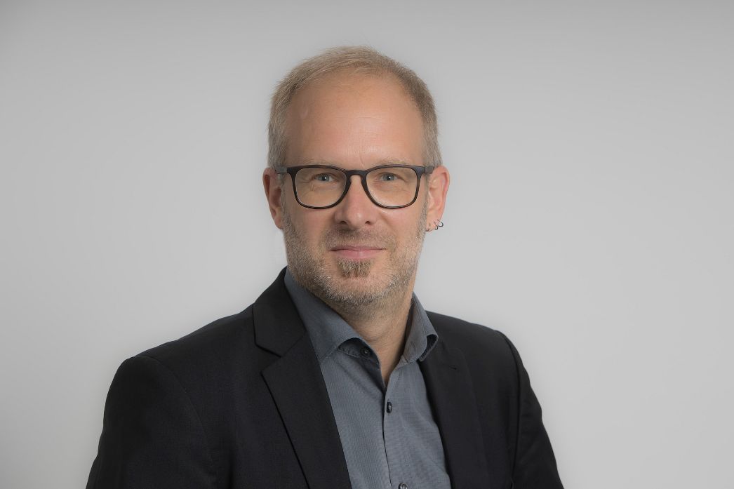 Portraitaufnahme von Dr. Philipp Neumann-Thein