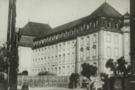 Photo of a large, four-story city building. 